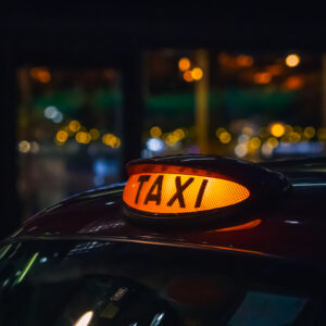 London black cab taxi sign at night