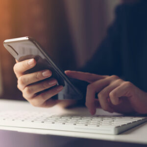 Woman using smartphone. The concept of using the phone is essential in everyday life.